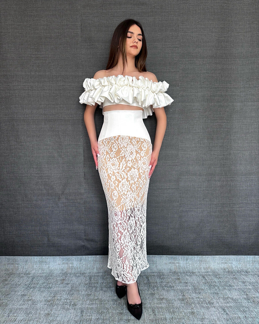 White ruffled off-shoulder top with a lace maxi skirt